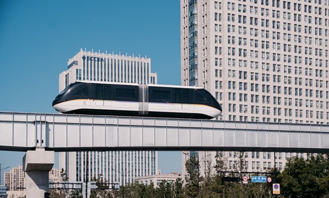 Airport train and city buildings